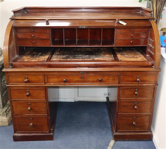 A pedestal cylinder bureau W.137cm